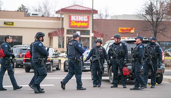 Police officers in front of King Supers