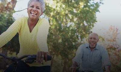 Elderly couple bike riding