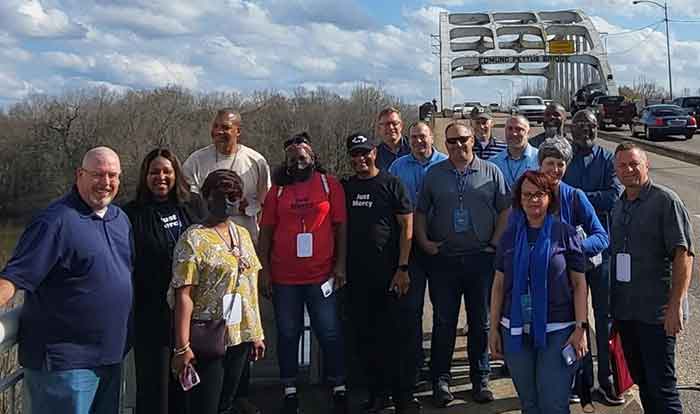 Group standing at bridge