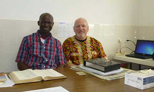 Ames and man studying bible