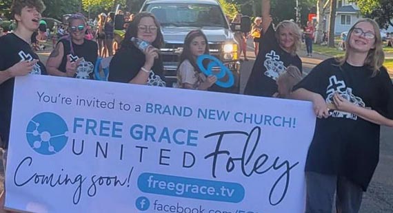 Kids holding banner in parade