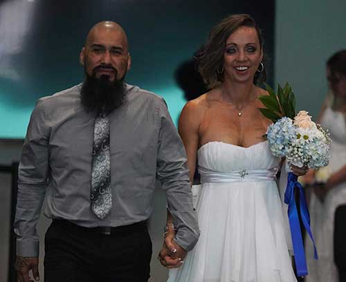 Couple walking down isle